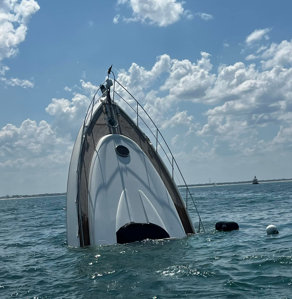 The Atlantis, pictured sinking on Saturday off the coast of Florida, had two passengers on board who were safely rescued